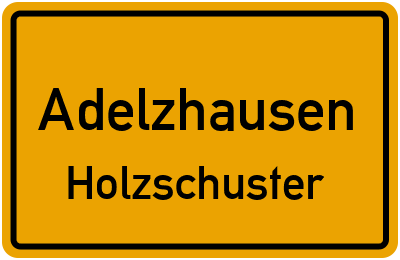Ortsschild Adelzhausen Holzschuster